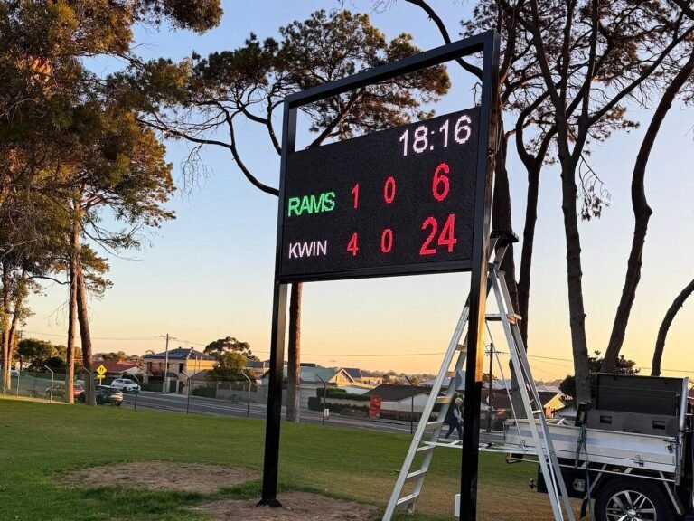 Portable LED scoreboard at a local oval at sunset